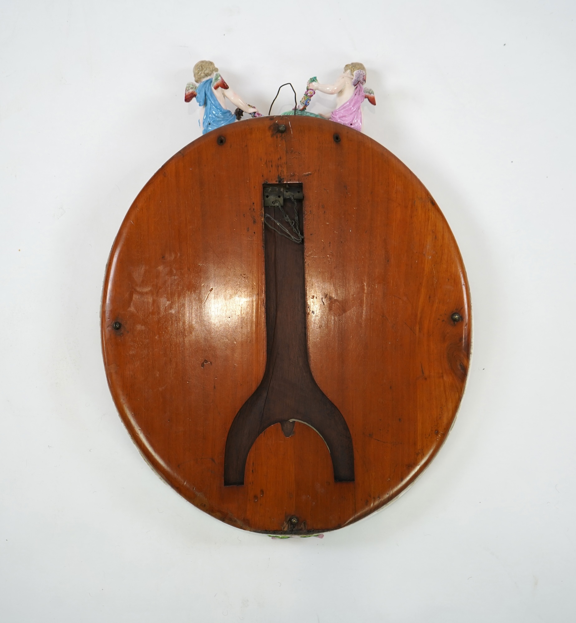 A Meissen figural oval mirror, late 19th century